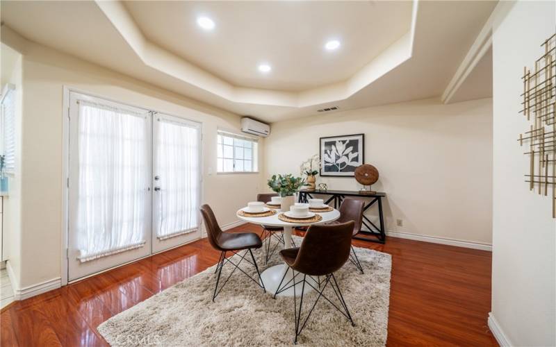 Dining area leads to the main floor balcony. AC wall unit is strong and cools the entire main floor in just minutes.