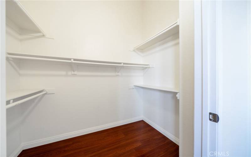 Primary bedroom walk-in closet.