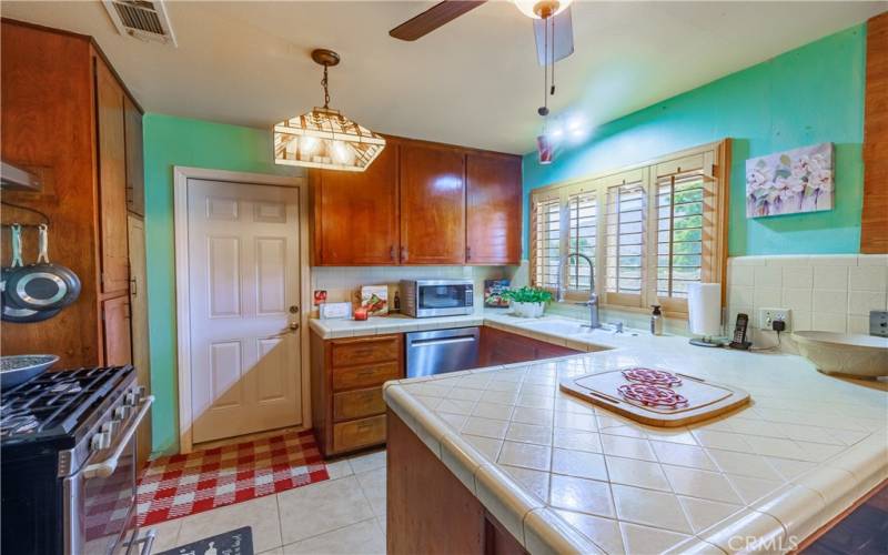 Door opens from the kitchen into the large 3 car garage