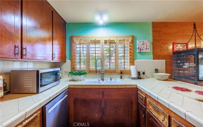 Open sink area with large window out to the front