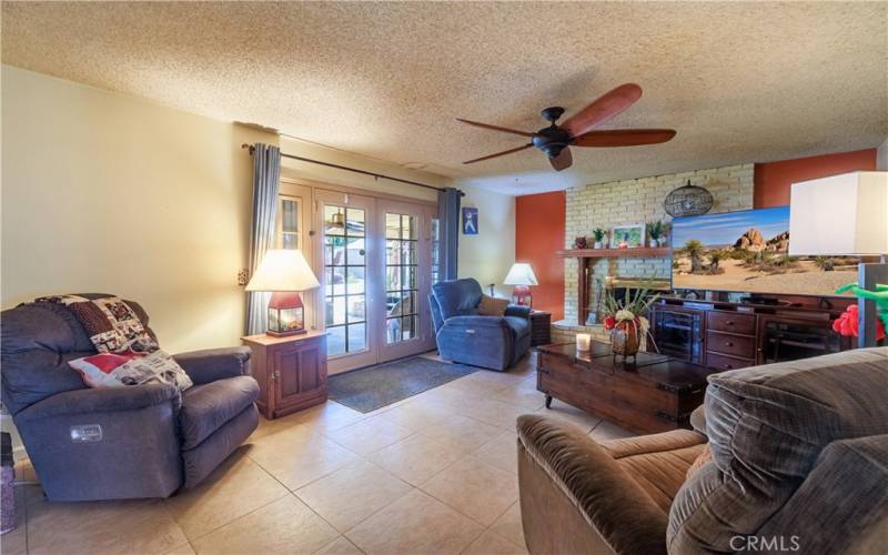 Cozy Living Room with French Doors out to the Covered patio Area