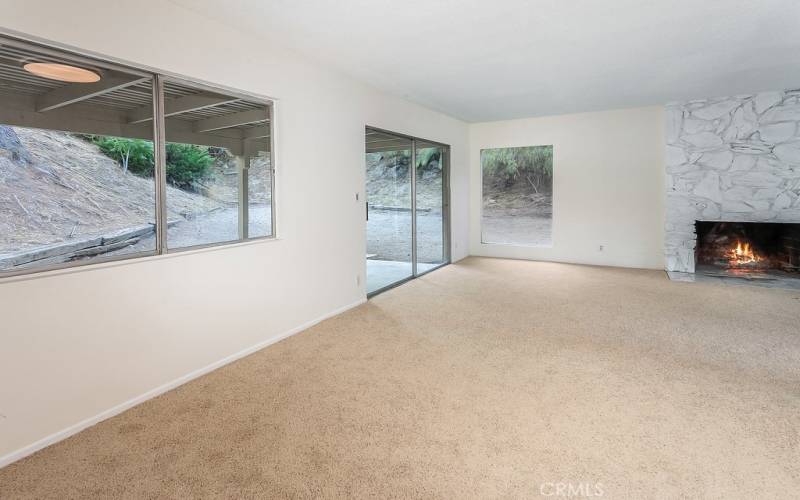 The formal dining room fittingly adjoins the kitchen and with its large sparkling window and new wall-to-wall carpet it is perfect for any occasion.