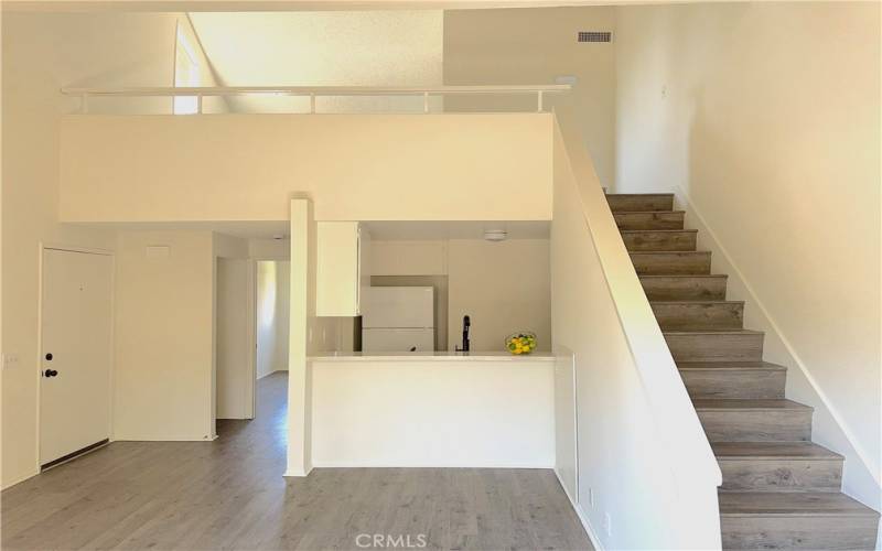 OPEN FLOOR PLAN WITH LOFT AND NEW WHITE PAINT THROUGHOUT CONDO.