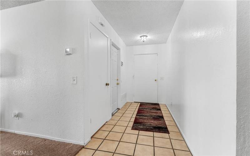 Entry with first door on the left leading to the two car garage and the next door is the closet. Room to the left is a roomy living room.