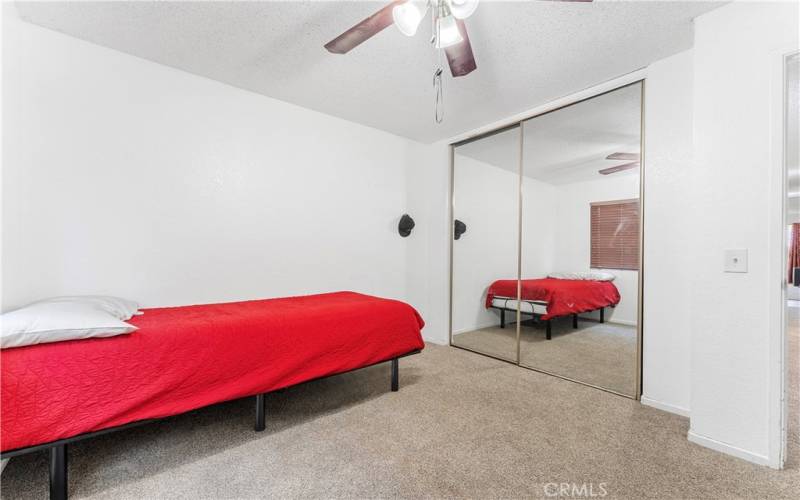 Three of five bedrooms with ceiling fan.