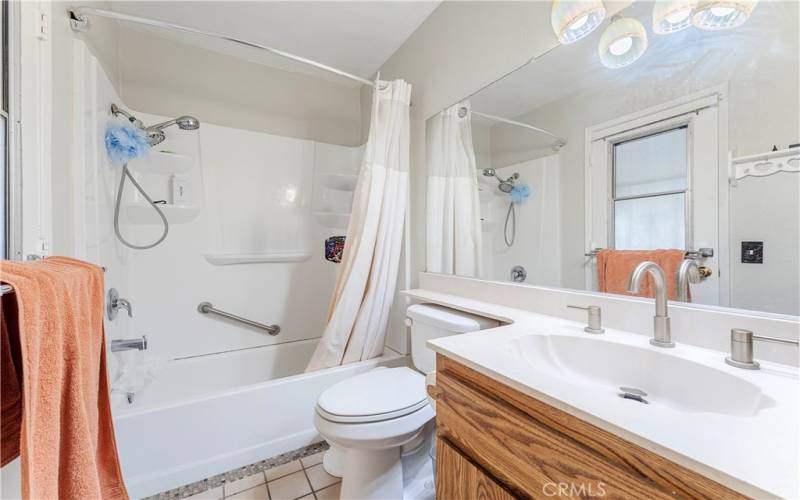 Primary en suite with door to the covered patio. This makes it convenient if you are playing outside or swimming and need to use the bathroom without getting the whole house wet or dirty.