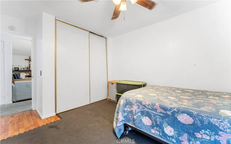 One of five bedrooms with ceiling fan. This room is nearest to the family room.