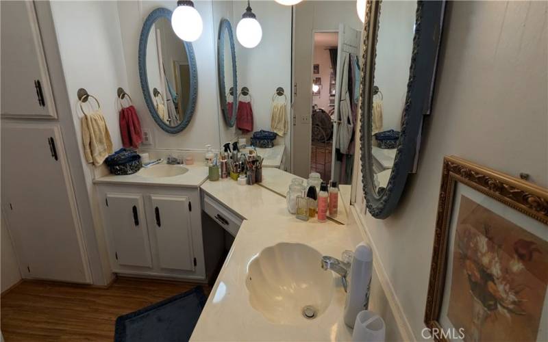 Double Sinks and Linen Closet in Primary Bath