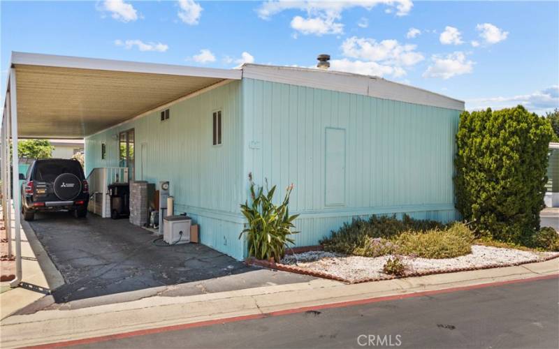 Spacious carport with entry to the kitchen area