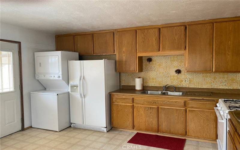 Kitchen with door to backyard deck