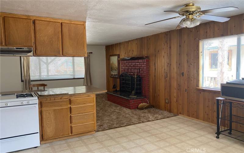 View to fireplace from kitchen