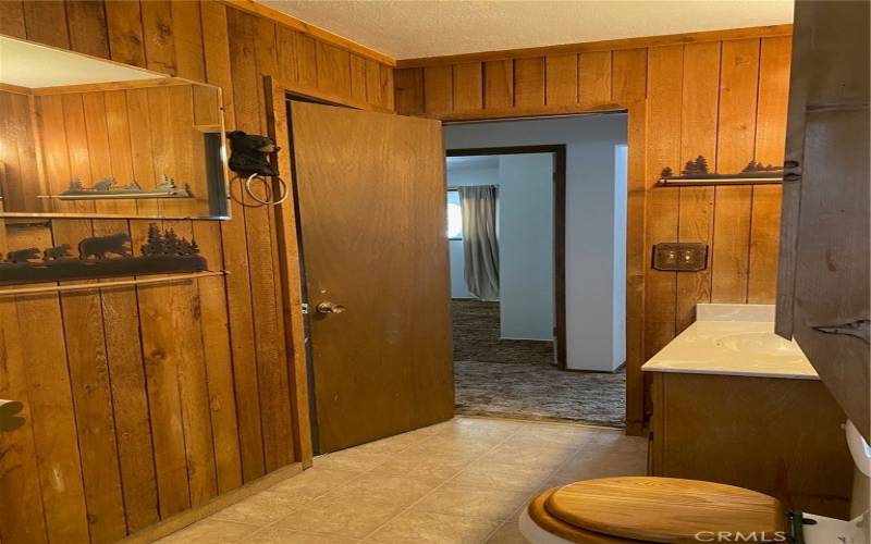 Bathroom view from shower 1 door to hall and one to back bedroom