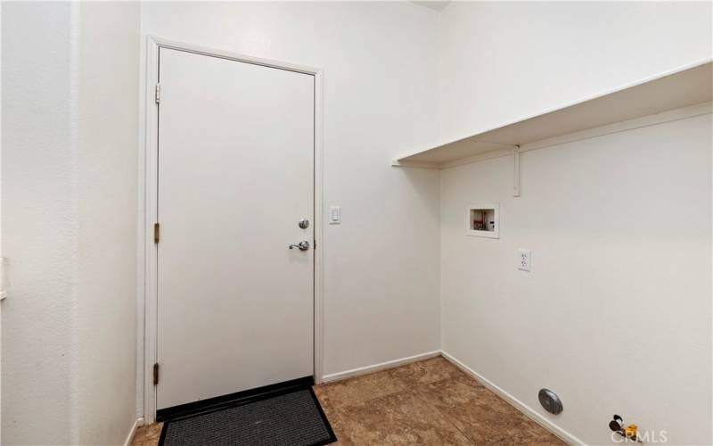 Laundry room connecting to garage