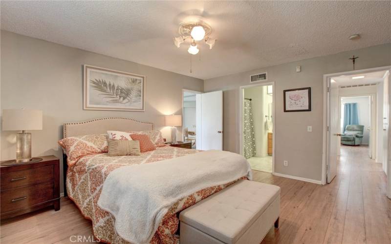 Main bedroom has doors to bonus room at left, main bathroom & hallway.