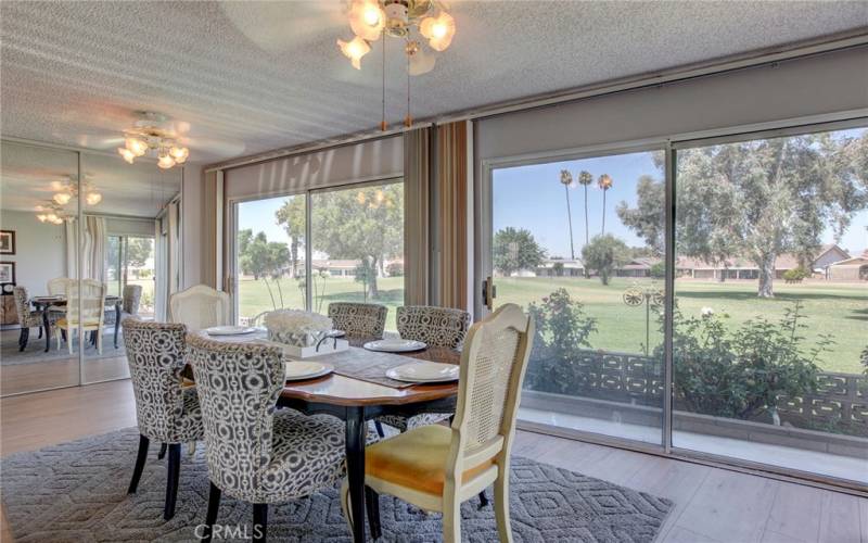 Panoramic golf course views from dining room at back of house.