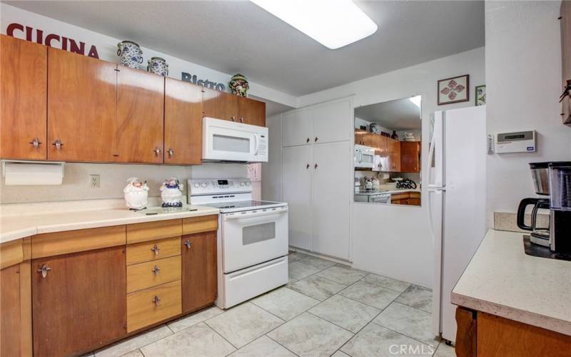 Kitchen boasts large pantry & access to bedrooms at end of kitchen.