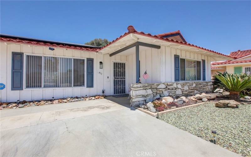 Low maintenance yard, & cute front porch.