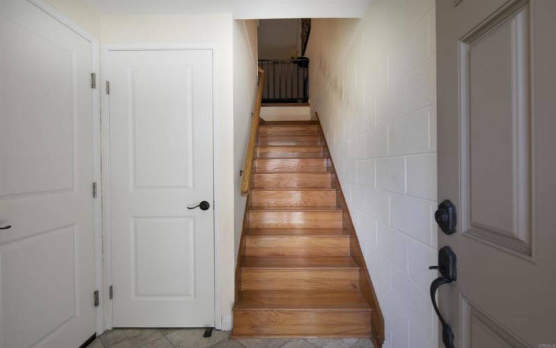 The door to the left is the entrance to the attached garage. The other door is a coat closet.