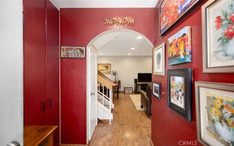 Foyer entrance with downstairs Powder room, and Stackable W/D in Closet on your left