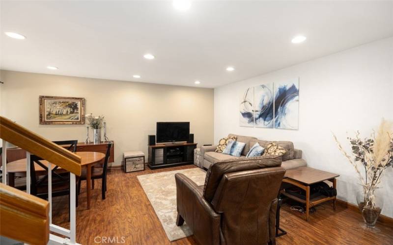 recently painted living room with newer Engineered Wood flooring, recessed lighting, stairs to upstairs two Master Suites