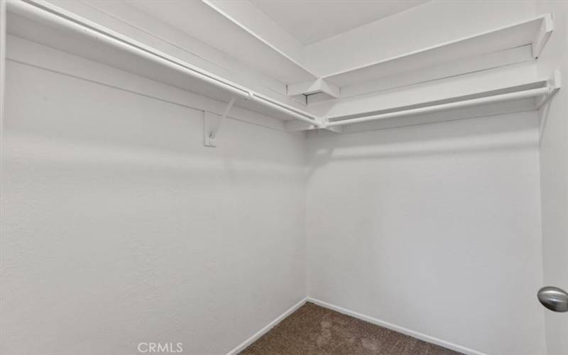 Walk-in closet. In Primary Bedroom