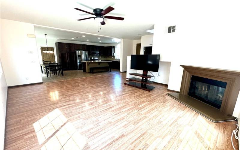 Great room with fireplace and ceiling fan