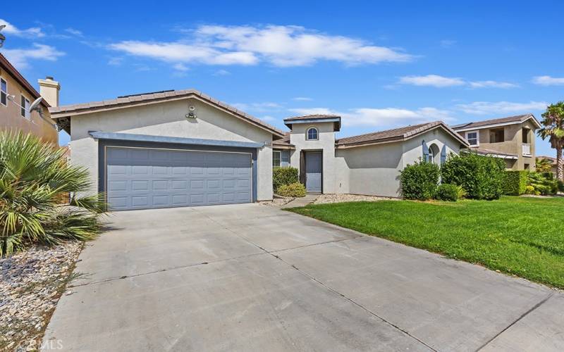 Garage view of front of house