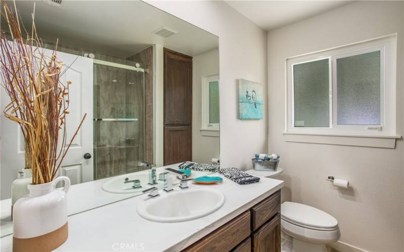 Hall Bath #2, remodeled including new tub, shower, vanity, windows, flooring.