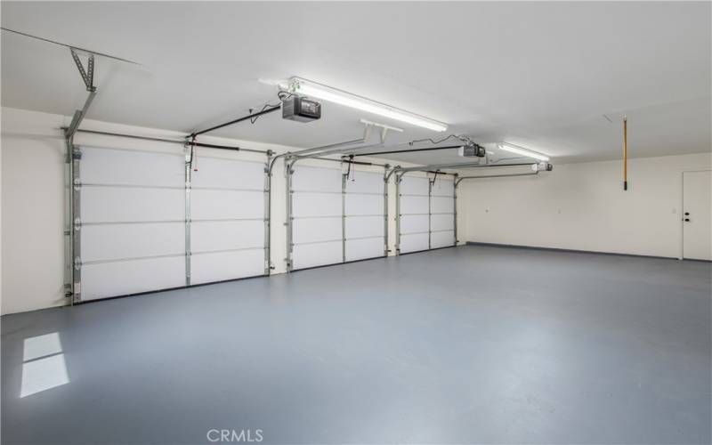 Refinished 3 car garage with all new roll up insulated doors and openers