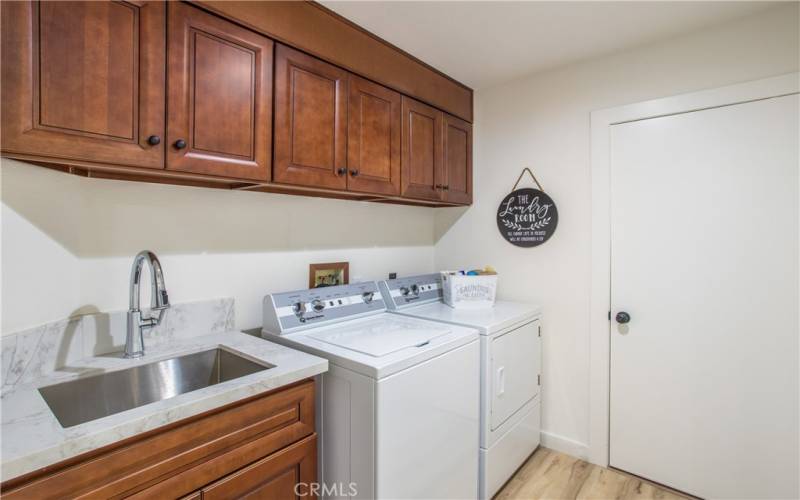 Remodeled Laundry room includes brand new SPEED QUEEN washer/dryer set, new cabinetry.   Also has deep

sink.