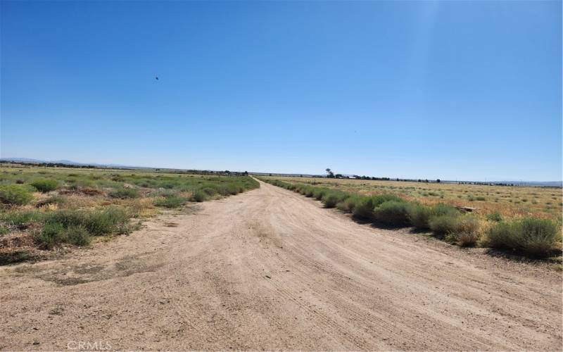 Dirt road entrance on Ave D & 130th St W towards north