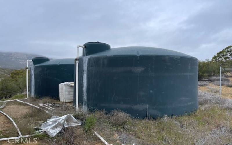 two 500-gallon water tanks