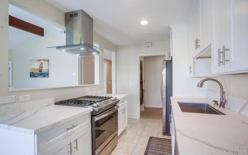 Pantry and laundry conveniently located next to the remodeled kitchen