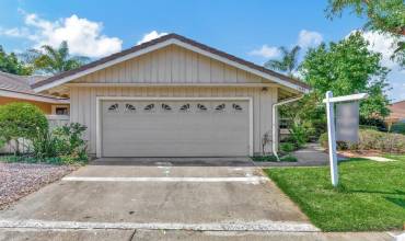 Oversized 2-Car Garage with walkway to the right leading to the Front Door.