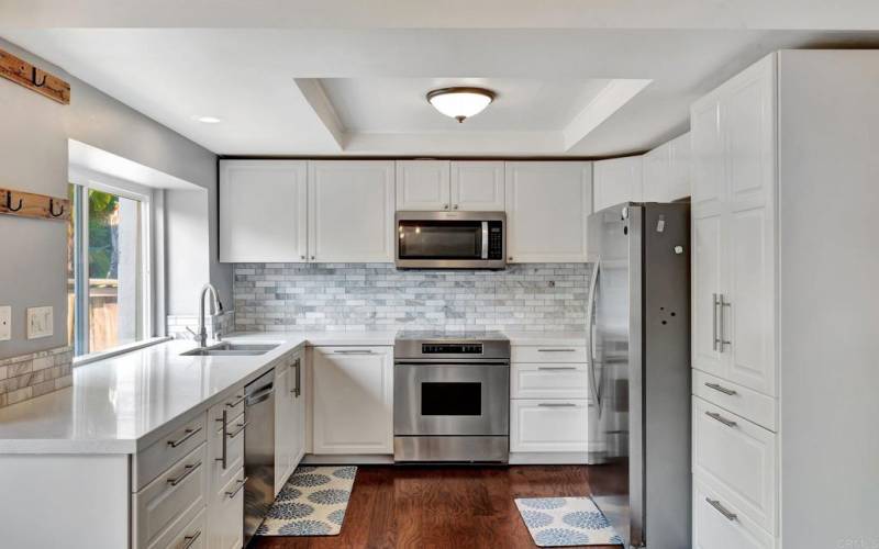 Kitchen with Stainless Steel Appliances and self-closing cabinets and drawers