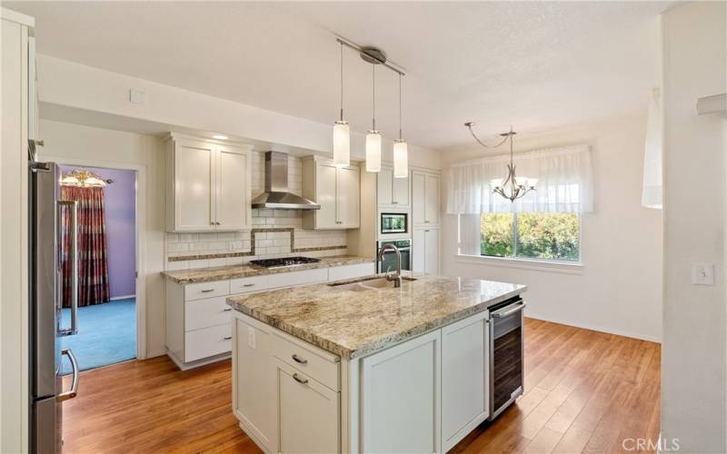 With a lovely center island that measures ~4.25’ x 6.25’, that also has a wine refrigerator, entertaining just got easier! AND, it also has a breakfast area!