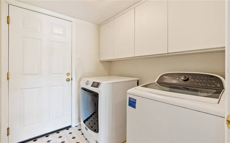 The indoor laundry has great finger-pull cabinets and is right next to the garage. Washer and dryer are included!