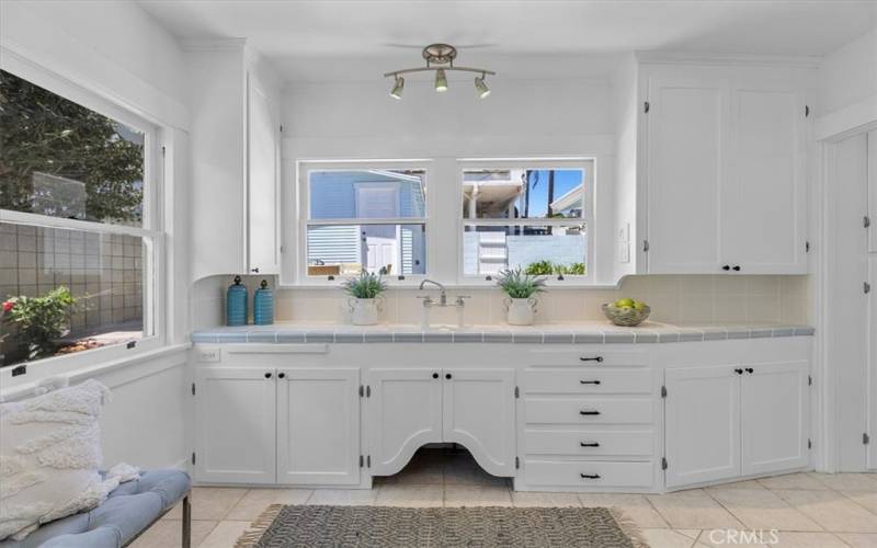 Kitchen with plenty of storage and view of the backyard