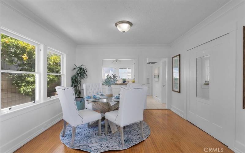 Dining room offer versatility with murphy bed behind the mirror