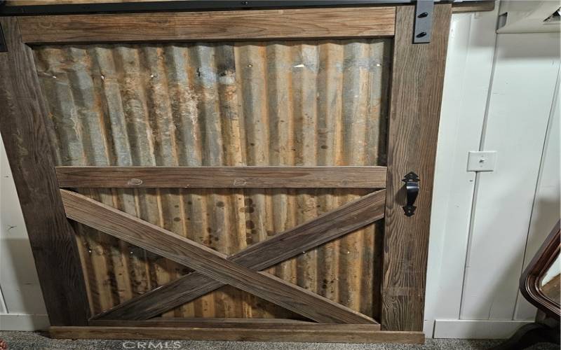 Door separating the bedroom from the bathroom