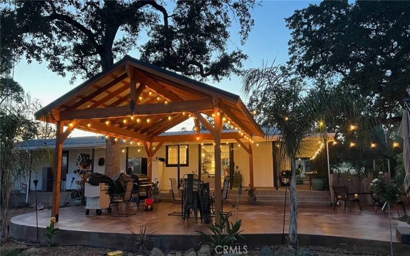 Gracious and beautiful back patio of the main home