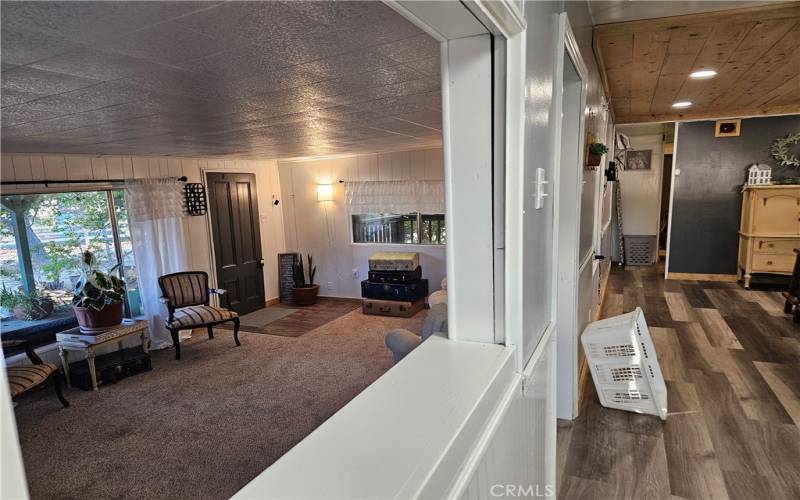 Living room has great openings into the kitchen.