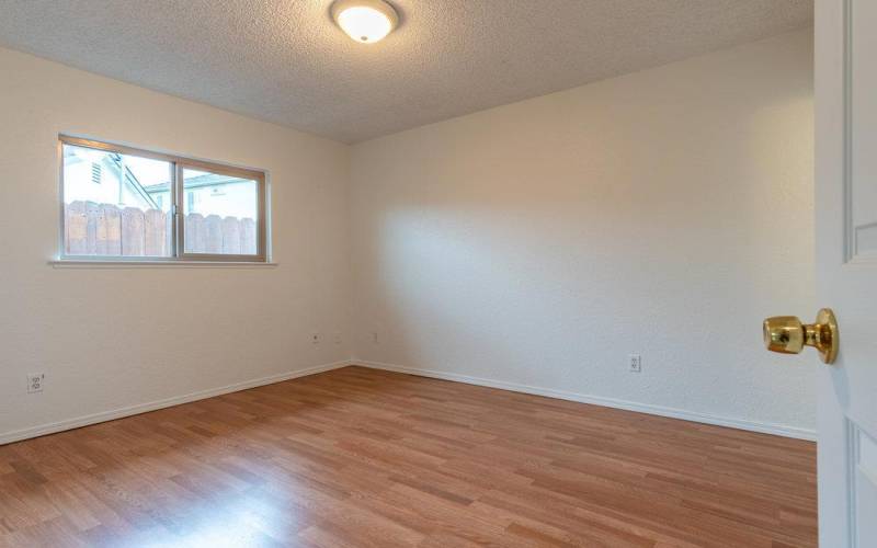 Owners Suite Bedroom - laminate flooring