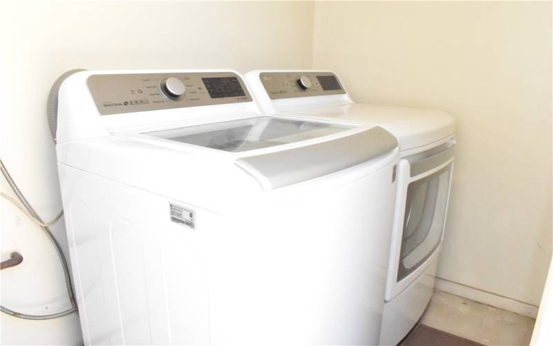 Laundry closet located outside side door. Appliances included