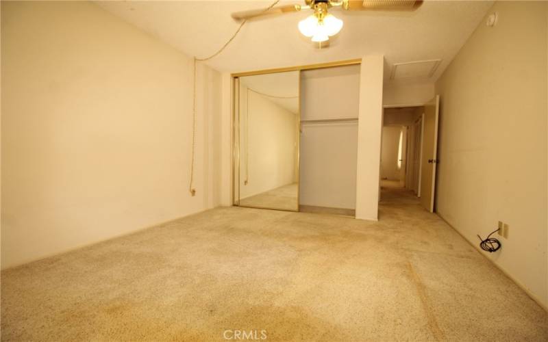 Main bedroom has mirrored closet doors