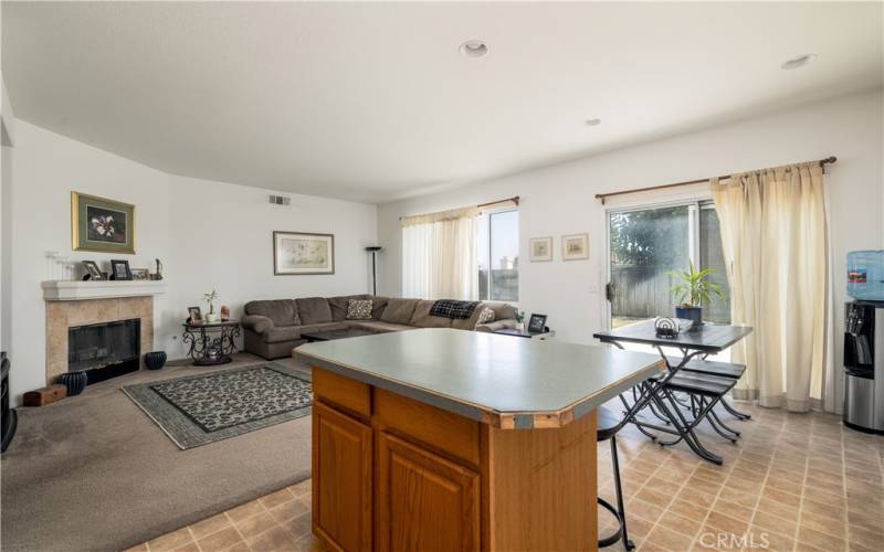 Kitchen overlooking family room and slider to the backyard.