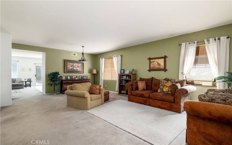 Front door entry into living room and dining room.