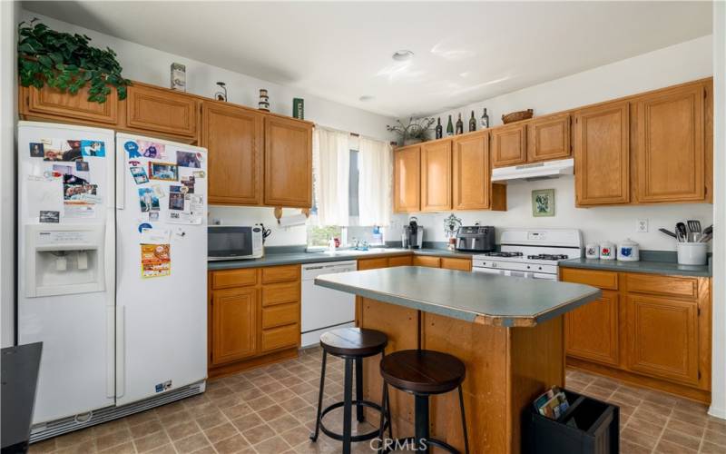 Kitchen with island and eating area.