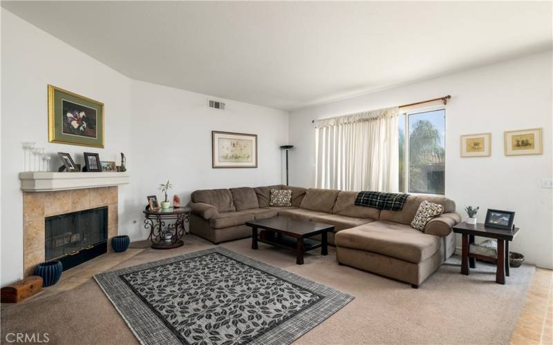 Nice and bright family room with fireplace.