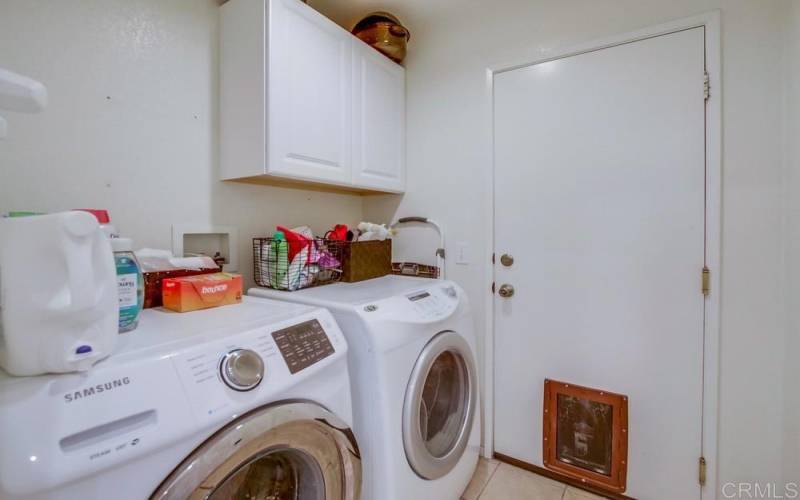 Laundry room is off the kitchen and room leads to garage.